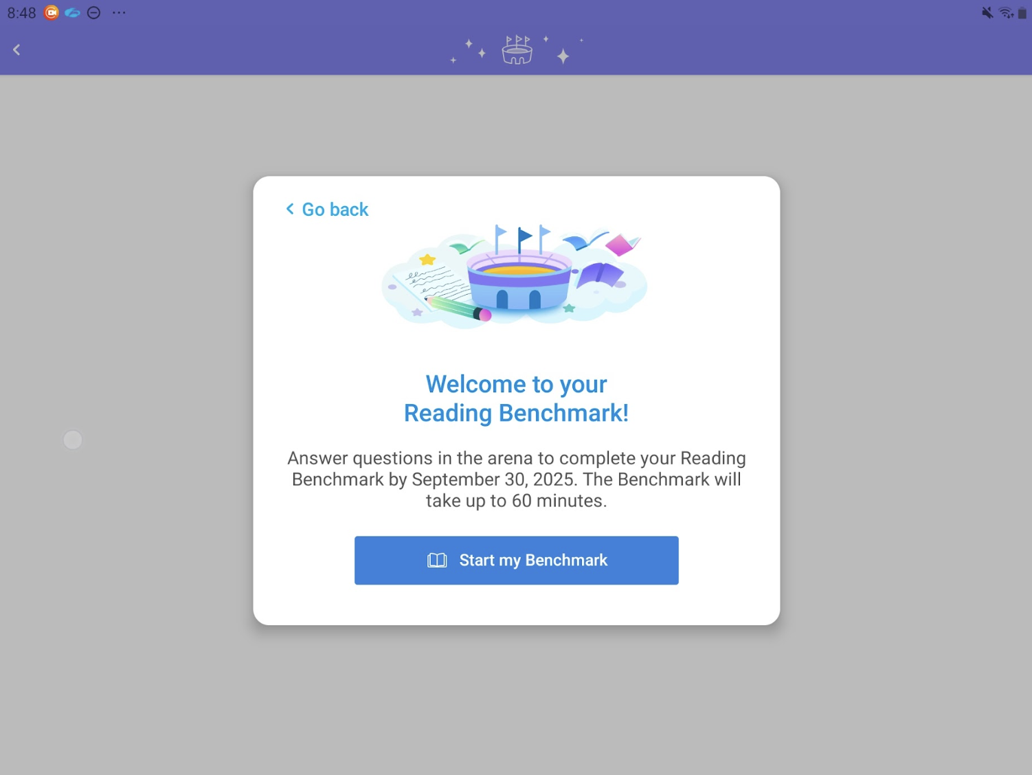 In front of a greyed out screen, a popup message says "Welcome to your Reading Benchmark! Answer questions in the arena to complete your Reading Benchmark by September 30, 2025. The Benchmark will take up to 60 minutes." There is also a button that says "Start my Benchmark." In the top let and right there are icons indicating that this is take from an Android device.